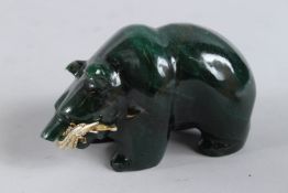 A GOOD RUSSIAN CARVED CRYSTAL POLAR BEAR , a gilt fish in its mouth. 4.25ins long.