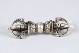 A TIBETAN WHITE METAL VAJRA. 5.25ins long.