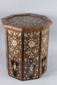 AN ISLAMIC MOTHER-OF-PEARL INLAID OCTAGONAL TABLE. 1ft 6.5ins high x 1ft 3ins diameter.