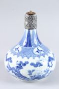 A CHINESE BLUE AND WHITE BOTTLE VASE converted to a lamp, with silver base. 9.5ins high (drilled