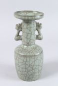 A CHINESE TWIN HANDLED VASE. 9.5ins high.
