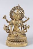 A GOOD GILT BRONZE MULTI-ARM DEITY. 9ins high.