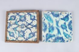 TWO 17TH CENTURY OTTOMAN IZNIK GLAZED POTTERY TILES (A/F). 10ins x 9ins and 9ins x 9ins.