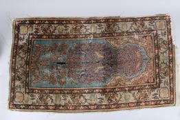 A SMALL PERSIAN SILK RUG with birds and foliage, circa 1900. 3ft 3ins x 2ft 10ins.