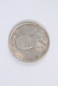 A CHINESE FATMAN TOKEN.