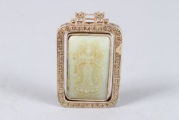 A CHINESE CELADON JADE PENDANT WITH MOUNTED WHITE METAL. 2ins x 1.75ins.