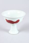 A CHINESE UNDERGROUND RED GLAZED STEM CUP.