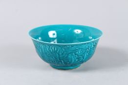 A CHINESE BLUE CIRCULAR BOWL. 6ins diameter.