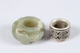 TOW CHINESE ARCHER'S RINGS, one jade, the other white metal.