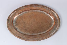 A PERSIAN QAJAR ENGRAVED BRASS OVAL DISH. 16ins x 11ins.