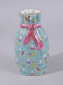 A CHINESE TURQUOISE GROUND FAMILLE ROSE PORCELAIN SACK-SHAPED VASE, painted with gourds and bats,