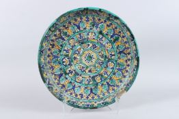 A LARGE 19TH CENTURY MOROCCAN POTTERY CHARGER. 16ins diameter.