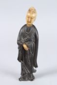 A 19TH CENTURY HARDWOOD (POSSIBLY ZITAN) FIGURE OF GUANYIN with soapstone head and hands.