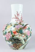 A LARGE CHINESE VASE painted with flowers and birds. 22ins high.