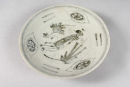 A CHINESE SHIPWRECK PORCELAIN DISH, with central bird and peach design. 20.5cms diameter.