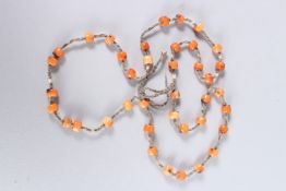 AN OLD CHINESE CORAL NECKLACE.