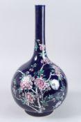 A QING DYNASTY STYLE GLAZED COLOURED PORCELAIN BOTTLE decorated with peonies. 16ins high.