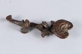A SMALL BRONZE RUI SCEPTRE. 3.5ins long.