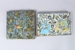 TWO PERSIAN QAJAR POTTERY TILES, one with two figures, 7.5ins x 11.5ins, and another with birds