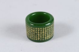 A CHINESE JADE ARCHER'S RING.