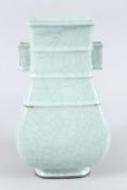 A CHINESE CELADON CRACKLE GLAZE TWIN HANDLED PORCELAIN VASE, of square baluster form. 31cms high.