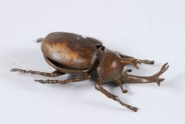 A JAPANESE OKIMONO BRONZE STAG BEETLE with articulated wing. 3.5ins high.