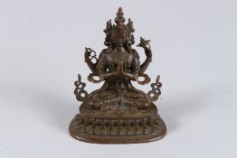 A SMALL BRONZE GOD FIGURE.