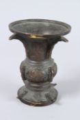 A SMALL BROWN CHINESE ARCHAIC VASE. 5ins high.