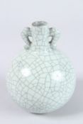 A CHINESE CRACKLE GLAZED BULBOUS VASE. 5.5ins high.