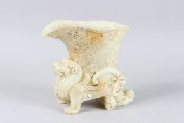 A GOOD WHITE JADE FOO DOG VESSEL. 8ins high.