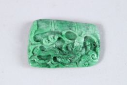 A CHINESE NATURAL COLOUR APPLE GREEN JADEITE PENDANT. 1.75ins x 1.5ins.