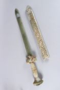 A GOOD JADE SWORD in a pierced sheath. 2ft long, in a case.