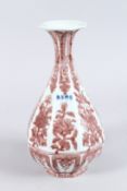 A CHINESE PORCELAIN OCTAGONAL SHAPE BOTTLE VASE, with underglaze red decoration. 28cms high.