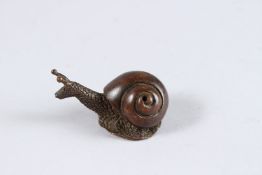 A JAPANESE OKIMONO BRONZE SNAIL. 1.5ins long.