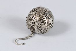 A PIERCED METAL BALL TRAVELLING CENSER on a chain. 2.25ins diameter.