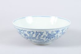 A CHINESE BLUE AND WHITE PORCELAIN BOWL, painted with a crane to the centre, dragons to the