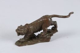 A JAPANESE BRONZE TIGER. 4.5ins high.