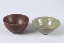 TWO TEA CUPS, one Jian ware bowl with dark glaze and hare's fur (or oil spot) pattern. The other