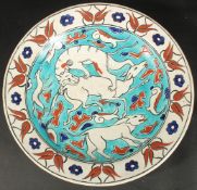 AN EARLY 20TH CENTURY BOCH FRERES KERAMIS IZNIK STYLE GLAZED POTTERY PLATE, painted with animals and