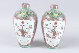 A GOOD PAIR OF SAMSON OF PARIS FAMILLE ROSE VASES, with metal tops, painted with panels of flowers