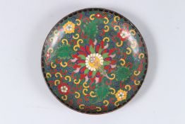 A ROUND CLOISONNE ENAMEL PLATE with a copper base, possibly late Qing Dynasty or early 1900's.