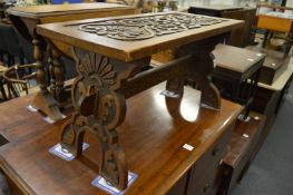 A carved walnut occasional table/stool.