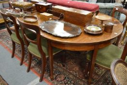 A mahogany dining table comprising pair of D ends and two leaves.
