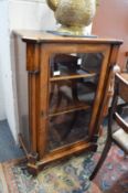 A Victorian figured walnut music or pier cabinet.