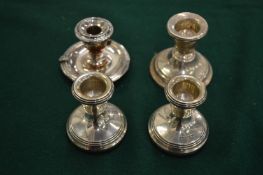 Silver dwarf candlesticks.