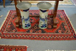 A small Persian rug, blue ground with stylised decoration, 155cm x 98cm.