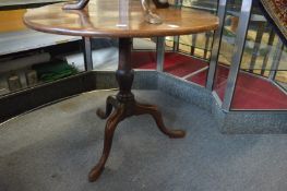 A George III mahogany circular tilt-top tripod table.