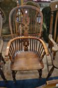A good 19th century yew and elm Windsor armchair.