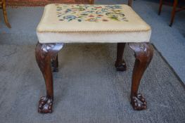 A good George III and later mahogany and needlework upholstered stool with well carved cabriole legs