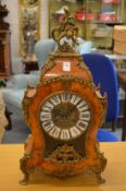 A decorative French mantel clock.